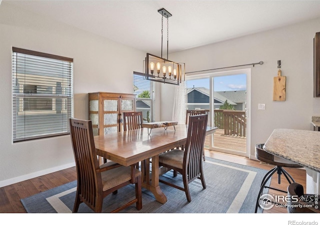 1325 Tipton St, Berthoud, CO 80513 - dining area with a chandelier and wood finished floors