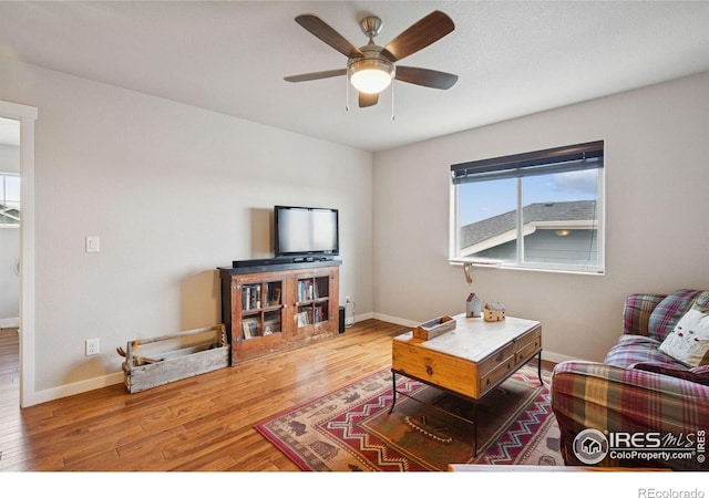 1325 Tipton St, Berthoud, CO 80513 - living area with wood finished floors and a ceiling fan