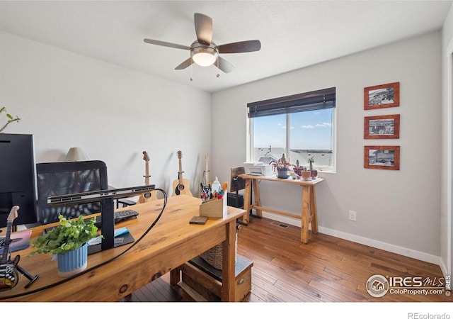 1325 Tipton St, Berthoud, CO 80513 - office with wood-type flooring and a ceiling fan