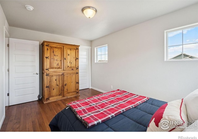 1325 Tipton St, Berthoud, CO 80513 - bedroom with dark wood-style floors and baseboards