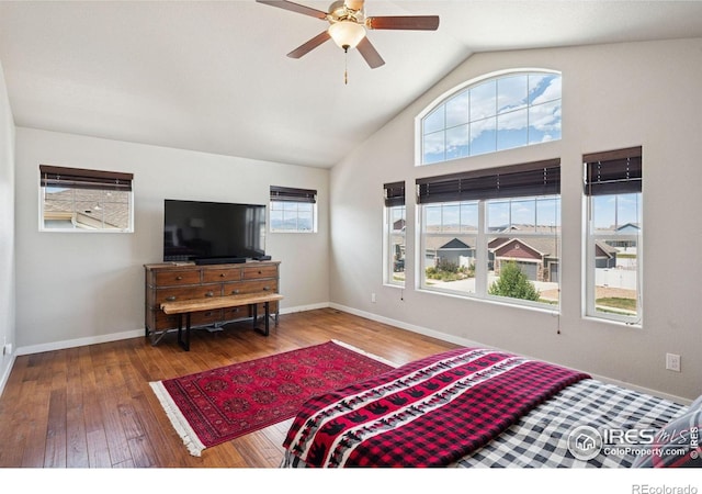 1325 Tipton St, Berthoud, CO 80513 - bedroom with wood-type flooring, vaulted ceiling, and a ceiling fan