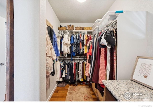 1325 Tipton St, Berthoud, CO 80513 - spacious closet featuring wood finished floors
