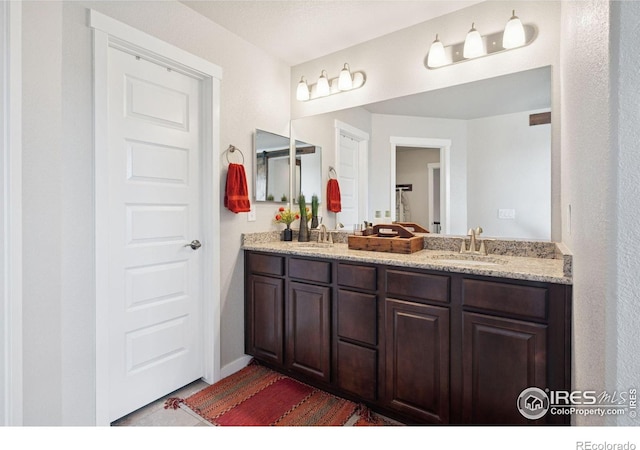 1325 Tipton St, Berthoud, CO 80513 - full bath featuring double vanity and tile patterned floors