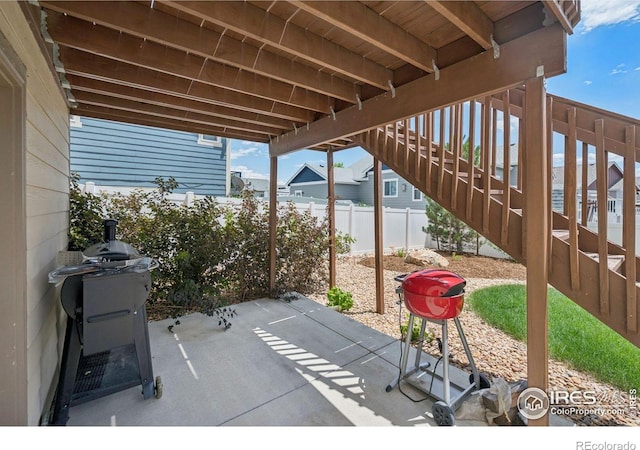 1325 Tipton St, Berthoud, CO 80513 - fenced backyard with stairs and a patio area