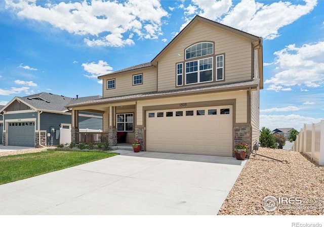 1325 Tipton St, Berthoud, CO 80513 - craftsman inspired home with covered porch, driveway, an attached garage, and stone siding