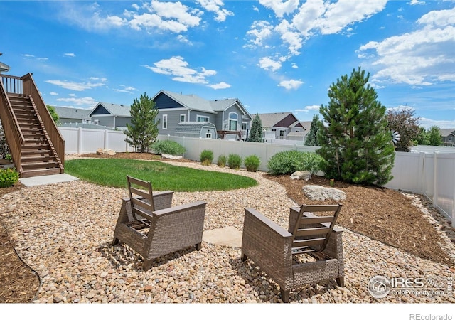 1325 Tipton St, Berthoud, CO 80513 - fenced backyard featuring stairway, a residential view, and a patio area