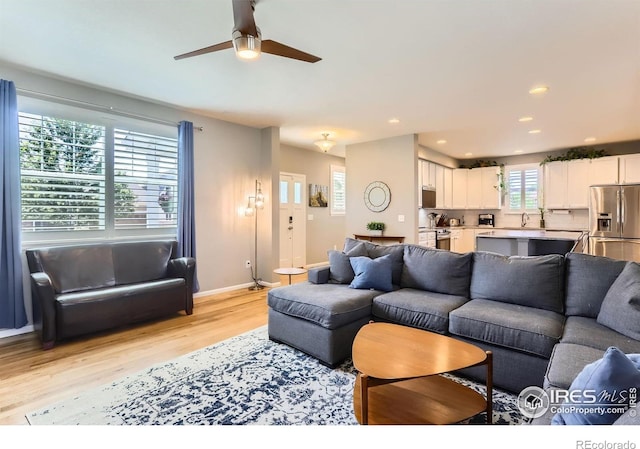 549 Jackson St, Lafayette, CO 80026 - living area with light wood-style floors, a ceiling fan, and recessed lighting