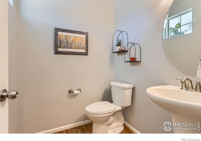 549 Jackson St, Lafayette, CO 80026 - half bathroom with toilet and wood finished floors