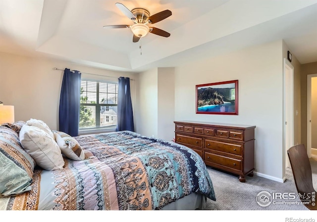 549 Jackson St, Lafayette, CO 80026 - bedroom with a raised ceiling, light colored carpet, and a ceiling fan