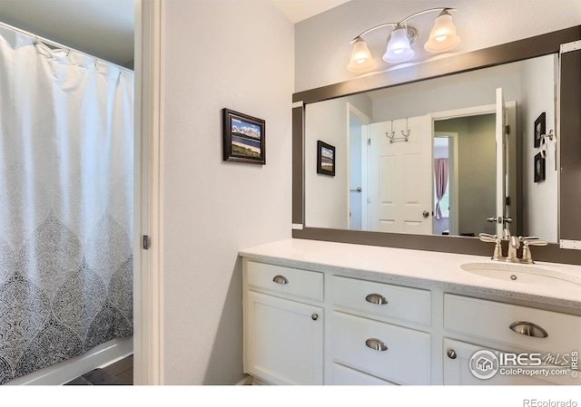 549 Jackson St, Lafayette, CO 80026 - bathroom featuring vanity and a shower with shower curtain