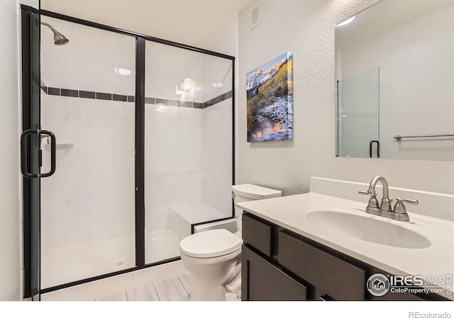 549 Jackson St, Lafayette, CO 80026 - bathroom with a stall shower, vanity, and a textured wall