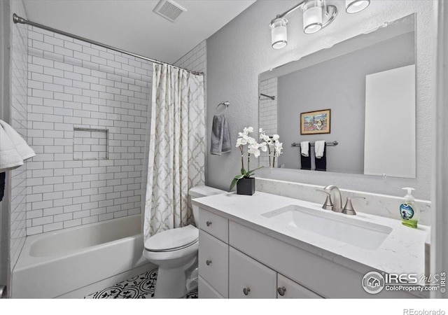 42 Scott Dr S, Broomfield, CO 80020 - bathroom with vanity, shower / bath combo, a textured wall, and tile patterned flooring
