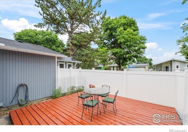 42 Scott Dr S, Broomfield, CO 80020 - wooden deck featuring outdoor dining space