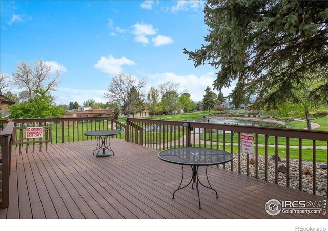 42 Scott Dr S, Broomfield, CO 80020 - wooden deck with a lawn