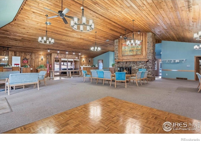 42 Scott Dr S, Broomfield, CO 80020 - carpeted dining area with a chandelier, a fireplace, high vaulted ceiling, wood ceiling, and ceiling fan