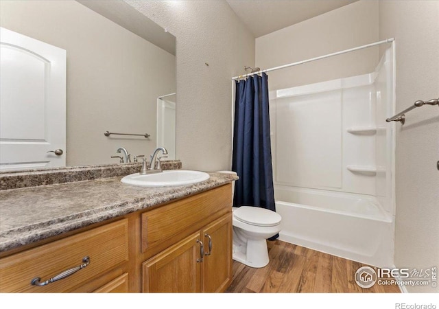 1520 Lake Vista Way, Severance, CO 80550 - bathroom with vanity, wood finished floors, and shower / bath combo with shower curtain