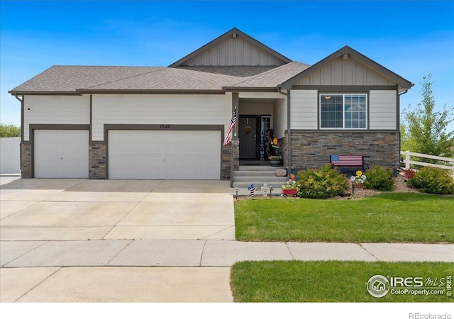 1520 Lake Vista Way, Severance, CO 80550 - view of front of home with an attached garage, stone siding, board and batten siding, and driveway