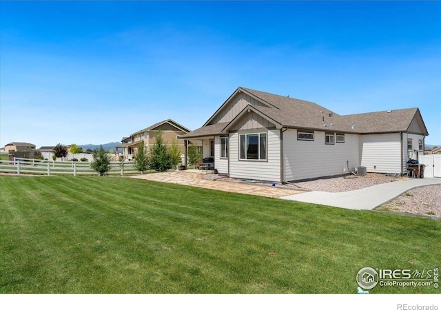 1520 Lake Vista Way, Severance, CO 80550 - back of house featuring board and batten siding and a patio area