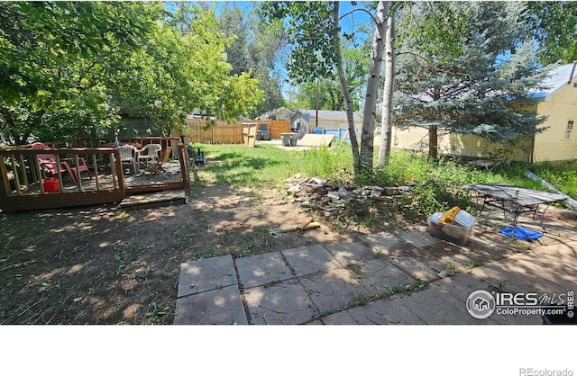 710 Carson St, Brush, CO 80723 - view of yard featuring a wooden deck