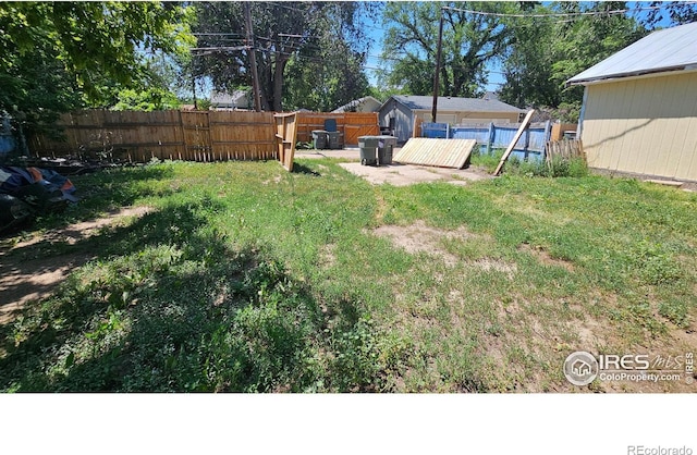 710 Carson St, Brush, CO 80723 - fenced backyard featuring a storage shed