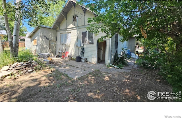 710 Carson St, Brush, CO 80723 - rear view of house with a patio area