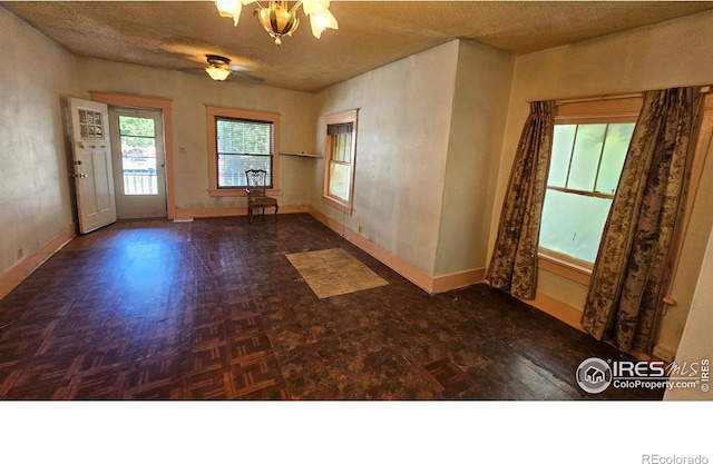 710 Carson St, Brush, CO 80723 - spare room featuring baseboards and a textured ceiling