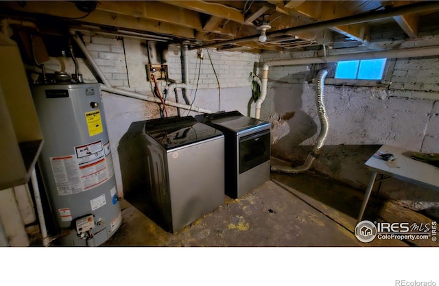 710 Carson St, Brush, CO 80723 - washroom with gas water heater and independent washer and dryer