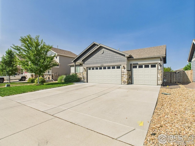 1729 Avery Plaza St, Severance, CO 80550 - craftsman-style house featuring a garage, stone siding, and driveway