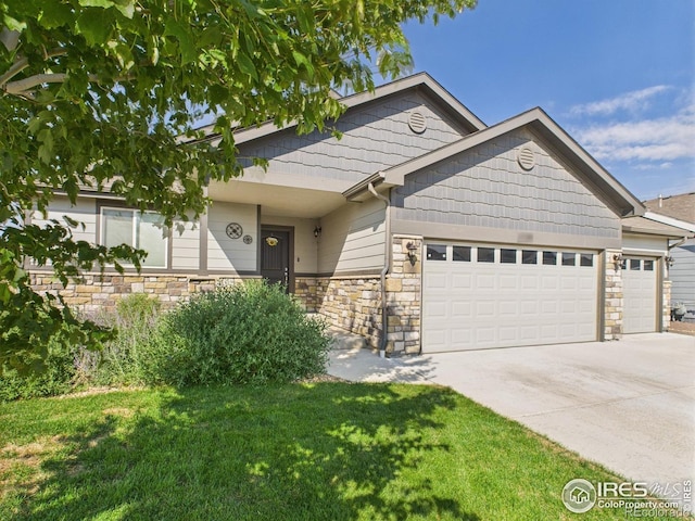 1729 Avery Plaza St, Severance, CO 80550 - view of front facade with a garage, stone siding, driveway, and a front lawn