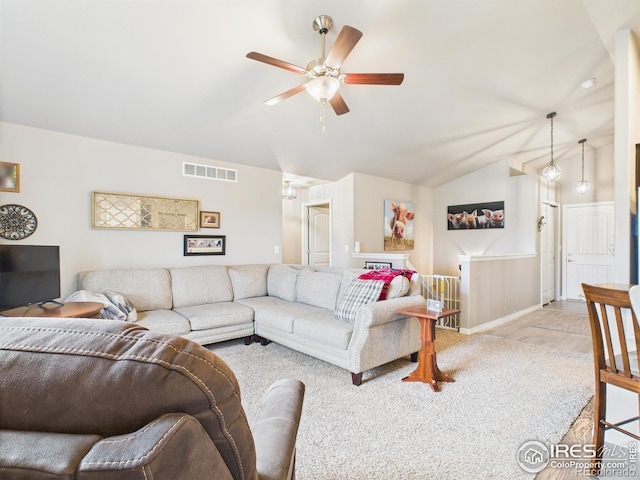 1729 Avery Plaza St, Severance, CO 80550 - living area with vaulted ceiling, a ceiling fan, and light carpet