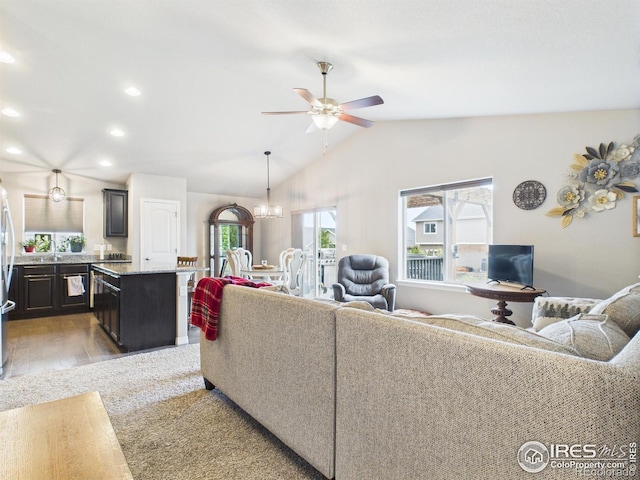 1729 Avery Plaza St, Severance, CO 80550 - living room with a ceiling fan, lofted ceiling, light wood-style flooring, recessed lighting, and a chandelier