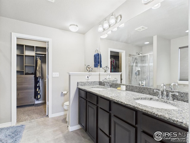 1729 Avery Plaza St, Severance, CO 80550 - full bathroom with double vanity, a spacious closet, and a stall shower