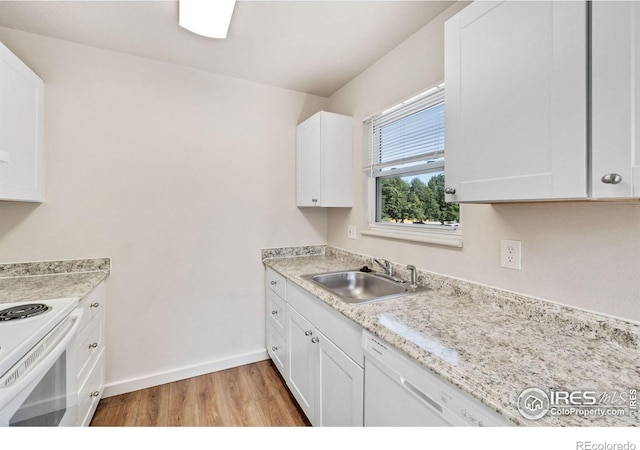 1620-1626 E 17th St, Loveland, CO 80538 - kitchen with light wood finished floors, white appliances, and white cabinetry