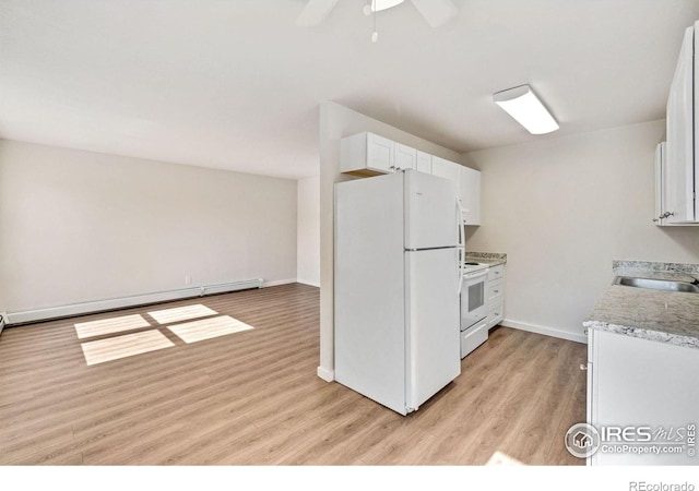 1620-1626 E 17th St, Loveland, CO 80538 - kitchen featuring white appliances, light wood-style floors, a baseboard heating unit, light countertops, and white cabinets