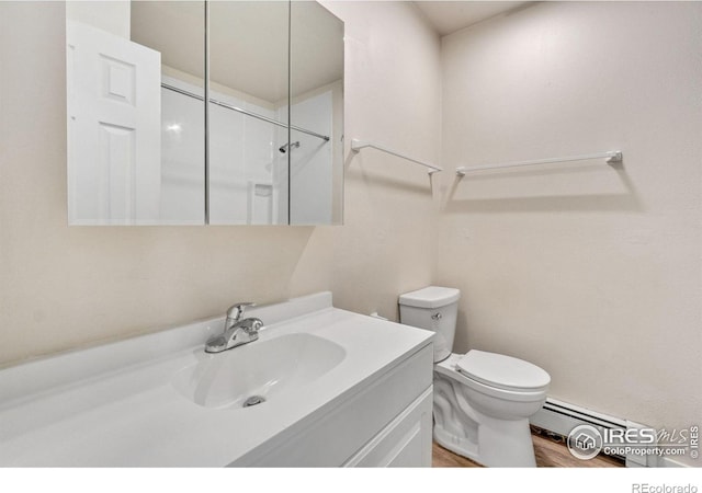 1620-1626 E 17th St, Loveland, CO 80538 - bathroom with baseboard heating, vanity, wood finished floors, and a shower