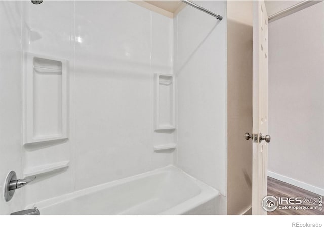 1620-1626 E 17th St, Loveland, CO 80538 - full bathroom with shower / bathtub combination and wood finished floors