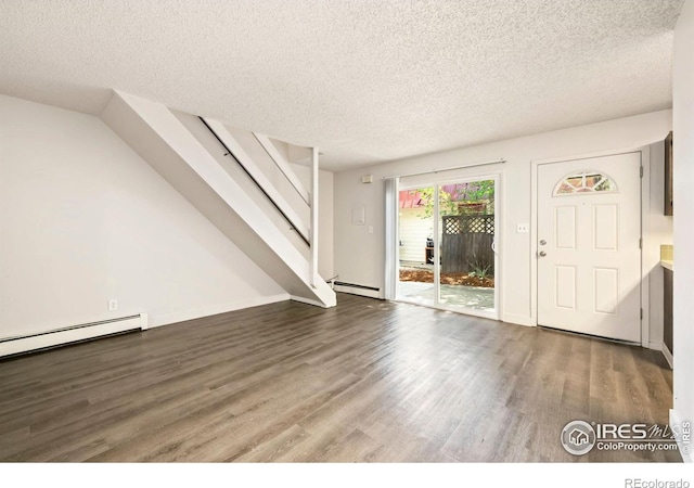 1620-1626 E 17th St, Loveland, CO 80538 - entryway featuring baseboard heating, a textured ceiling, wood finished floors, and stairway