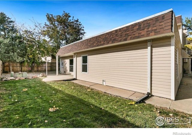 1620-1626 E 17th St, Loveland, CO 80538 - back of house with roof with shingles and a patio