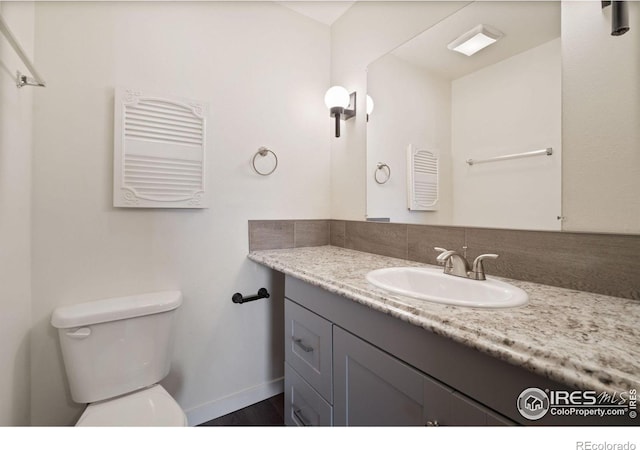 1620-1626 E 17th St, Loveland, CO 80538 - bathroom featuring vanity and wood finished floors