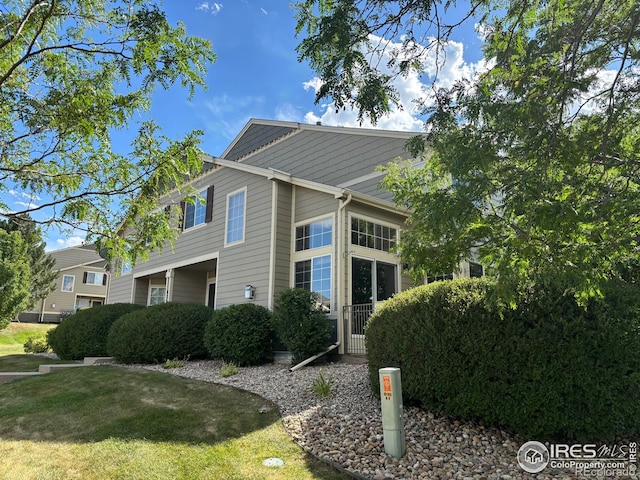 6721 Antigua Dr Unit 57, Fort Collins, CO 80525 - view of side of property with a yard