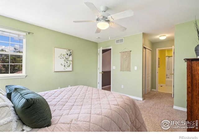 6721 Antigua Dr Unit 57, Fort Collins, CO 80525 - bedroom with connected bathroom, carpet flooring, a closet, and a ceiling fan