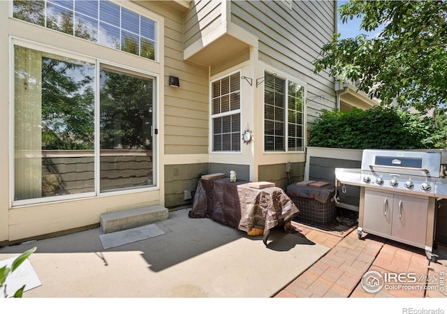 6721 Antigua Dr Unit 57, Fort Collins, CO 80525 - view of patio featuring a grill