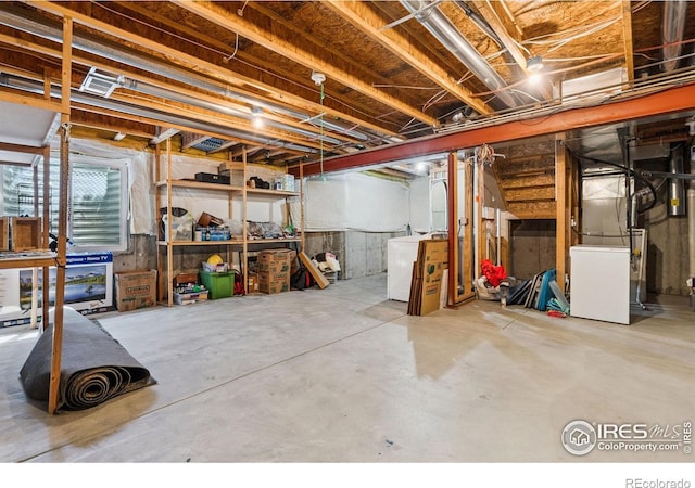 6721 Antigua Dr Unit 57, Fort Collins, CO 80525 - basement featuring washer / dryer and heating unit