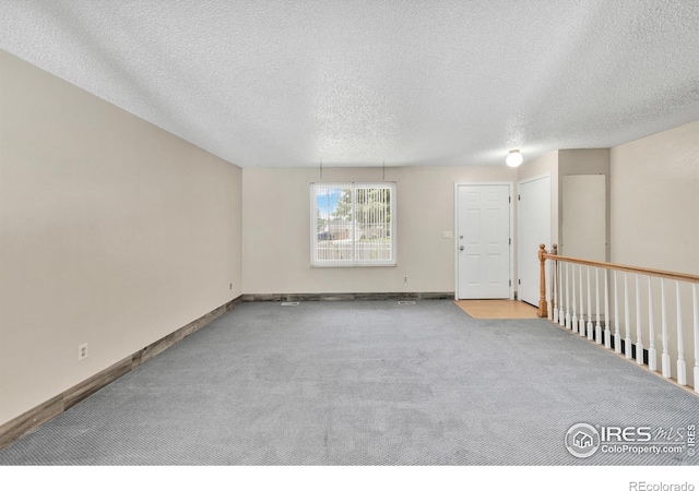 11450 Hudson St, Thornton, CO 80233 - unfurnished room featuring carpet floors and a textured ceiling