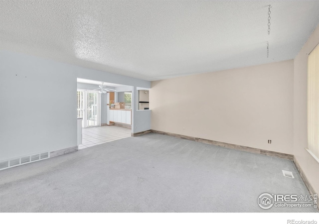 11450 Hudson St, Thornton, CO 80233 - carpeted empty room featuring a textured ceiling and a ceiling fan