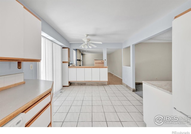 11450 Hudson St, Thornton, CO 80233 - kitchen featuring ceiling fan, light countertops, and white cabinets