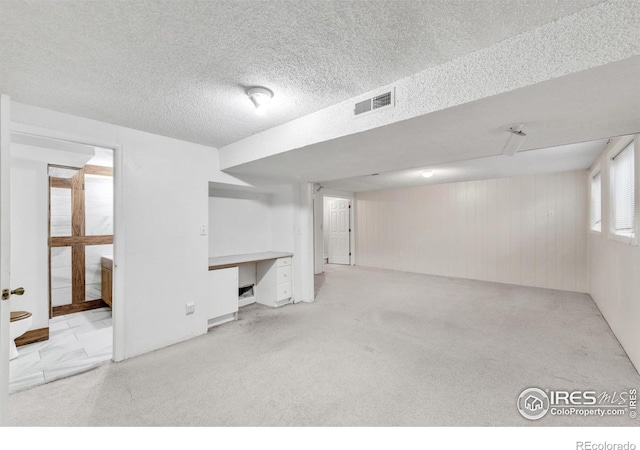 11450 Hudson St, Thornton, CO 80233 - below grade area featuring an office area, carpet floors, and a textured ceiling