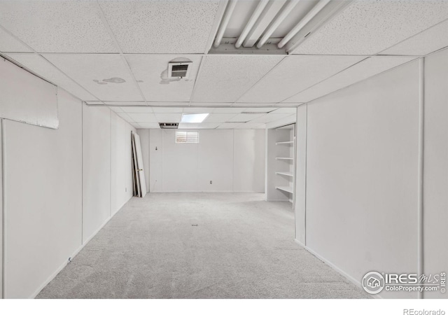 11450 Hudson St, Thornton, CO 80233 - finished below grade area with carpet and a paneled ceiling