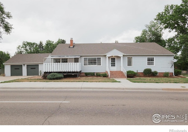 1539 Peterson St, Fort Collins, CO 80524 - single story home featuring concrete driveway, a chimney, and roof with shingles