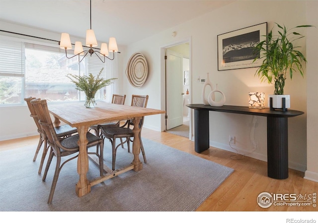 1539 Peterson St, Fort Collins, CO 80524 - dining room featuring a chandelier and light wood finished floors